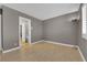 Empty bedroom featuring a lamp, bathroom access, and window with blinds at 9021 Feather River Ct, Las Vegas, NV 89117