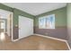 Empty bedroom featuring a 2-tone paint scheme, window with blinds, and closet at 9021 Feather River Ct, Las Vegas, NV 89117