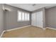 Empty bedroom featuring a large window with blinds, and sliding door closet at 9021 Feather River Ct, Las Vegas, NV 89117