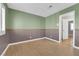Empty bedroom featuring a 2-tone paint scheme, and doorway to other rooms at 9021 Feather River Ct, Las Vegas, NV 89117
