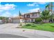 Charming two-story home featuring a well-manicured lawn, tile roof, and a two car garage at 9021 Feather River Ct, Las Vegas, NV 89117