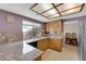 Traditional kitchen features granite counters, light wood cabinets, and recessed light fixture at 9021 Feather River Ct, Las Vegas, NV 89117