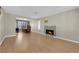 Bright living room with a fireplace and ample space for dining with hardwood floors throughout at 9021 Feather River Ct, Las Vegas, NV 89117