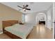 Comfortable main bedroom with a ceiling fan and bonus room with wooden desk at 9021 Feather River Ct, Las Vegas, NV 89117