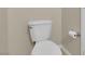 This toilet features a white seat and tank with a silver handle and paper holder at 9021 Feather River Ct, Las Vegas, NV 89117