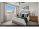 Bright bedroom with a large window, neutral decor, and a comfortable bed at 9674 Biedler Ct # Lot 10, Las Vegas, NV 89178