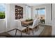 Dining room with seating for six, modern decor, and access to an outdoor patio at 9674 Biedler Ct # Lot 10, Las Vegas, NV 89178
