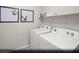 Laundry room area with side by side washer and dryer and decor at 9674 Biedler Ct # Lot 10, Las Vegas, NV 89178