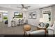 Neutral toned living area with lots of natural light, wood floors, and modern furniture at 9674 Biedler Ct # Lot 10, Las Vegas, NV 89178
