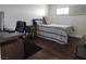 Serene bedroom retreat with a dark wood floor and a dedicated workspace at , Henderson, NV 89015