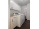 Functional laundry room with washer, dryer, and ample cabinet space at , Henderson, NV 89015