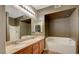 Bright bathroom with double sinks, large tub, and tiled floor at 10001 Peace Way # 1341, Las Vegas, NV 89147