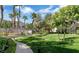 Lush green common area featuring walkways, trees, and landscaping at 10001 Peace Way # 1341, Las Vegas, NV 89147
