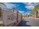 Inviting entrance to the 'Chateau Nouveau' community features lush landscaping and a welcoming atmosphere at 10001 Peace Way # 1341, Las Vegas, NV 89147