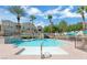 Large community pool with pristine water, lush landscaping, and inviting lounge areas for residents at 10001 Peace Way # 1341, Las Vegas, NV 89147