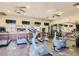 Community gym featuring modern exercise equipment, ceiling fans and mirrored walls at 10001 Peace Way # 1341, Las Vegas, NV 89147