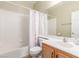 Bathroom with a shower and tub combination featuring a single sink vanity at 10191 Deerfield Beach Ave # 202, Las Vegas, NV 89129