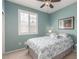 Bedroom featuring a window with plantation shutters and a ceiling fan at 10191 Deerfield Beach Ave # 202, Las Vegas, NV 89129