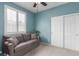 Cozy bedroom featuring a window with plantation shutters and a closet at 10191 Deerfield Beach Ave # 202, Las Vegas, NV 89129