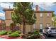 Attractive home exterior with lush landscaping and a charming tree in the front yard at 10191 Deerfield Beach Ave # 202, Las Vegas, NV 89129