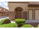 Charming front entrance with a well-maintained lawn and a cozy 'welcome' sign at 10191 Deerfield Beach Ave # 202, Las Vegas, NV 89129