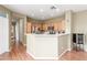 Well-lit kitchen with stainless steel appliances and wood cabinetry, open to other living areas at 10191 Deerfield Beach Ave # 202, Las Vegas, NV 89129