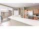 Bright kitchen featuring modern appliances, sleek countertops, and a seamless connection to the balcony at 10191 Deerfield Beach Ave # 202, Las Vegas, NV 89129