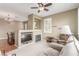 Spacious living room featuring a fireplace, comfortable seating, and an open layout to the dining area at 10191 Deerfield Beach Ave # 202, Las Vegas, NV 89129