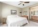 Cozy primary bedroom with a ceiling fan, ample natural light, and an adjoining bathroom at 10191 Deerfield Beach Ave # 202, Las Vegas, NV 89129