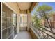 Private balcony with metal railings, offering views of the residential community at 10553 Pine Pointe Ave # 203, Las Vegas, NV 89144