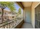Outdoor balcony featuring metal railings and serene neighborhood views at 10553 Pine Pointe Ave # 203, Las Vegas, NV 89144