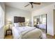 Cozy bedroom featuring mirrored closet doors, wood floors and bright window at 10553 Pine Pointe Ave # 203, Las Vegas, NV 89144
