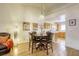 Charming dining area features hardwood floors and is open to the kitchen and living room at 10553 Pine Pointe Ave # 203, Las Vegas, NV 89144