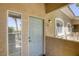 Exterior of a unit, features a well-lit entrance and an easy access window at 10553 Pine Pointe Ave # 203, Las Vegas, NV 89144