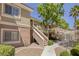 Condo exterior with private entrance and landscaping features, creating a welcoming atmosphere at 10553 Pine Pointe Ave # 203, Las Vegas, NV 89144