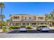Apartment building featuring covered parking, well-maintained landscaping and easy access to upper-level units at 10553 Pine Pointe Ave # 203, Las Vegas, NV 89144