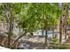 Community pool surrounded by palm trees and landscaping, creating a relaxing outdoor space at 10553 Pine Pointe Ave # 203, Las Vegas, NV 89144