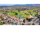 Picturesque aerial view of a golf course community featuring lush green fairways and well-maintained homes at 10557 Shoalhaven Dr, Las Vegas, NV 89134