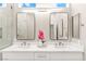 Bright bathroom features double sinks, sleek mirrors, and a minimalist design at 10557 Shoalhaven Dr, Las Vegas, NV 89134