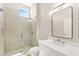 Clean bathroom showcasing a glass shower, toilet, and single sink at 10557 Shoalhaven Dr, Las Vegas, NV 89134