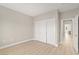Neutral bedroom with light wood floors, closet with sliding doors, and simple trim at 10557 Shoalhaven Dr, Las Vegas, NV 89134