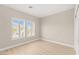 Simple bedroom with hardwood floors, bright shuttered windows, and neutral paint at 10557 Shoalhaven Dr, Las Vegas, NV 89134