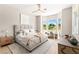 Comfortable bedroom featuring a bay window with scenic views and neutral décor at 10557 Shoalhaven Dr, Las Vegas, NV 89134
