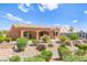 Charming home exterior with desert landscaping and inviting covered patio space at 10557 Shoalhaven Dr, Las Vegas, NV 89134