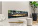 Contemporary electric fireplace on a textured wall with modern furniture and decor at 10557 Shoalhaven Dr, Las Vegas, NV 89134