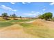 Beautiful view of the lush green golf course with clear blue skies in the background at 10557 Shoalhaven Dr, Las Vegas, NV 89134