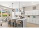 Bright kitchen features a center island, pendant lighting, and a breakfast nook with picturesque views at 10557 Shoalhaven Dr, Las Vegas, NV 89134