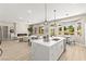 Open-concept kitchen features a large island, seamlessly flowing into the dining and living areas at 10557 Shoalhaven Dr, Las Vegas, NV 89134