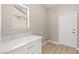 Functional laundry room with ample counter space, storage cabinets, and modern flooring at 10557 Shoalhaven Dr, Las Vegas, NV 89134
