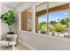 Living room chair near windows offering lush views of golf course at 10557 Shoalhaven Dr, Las Vegas, NV 89134